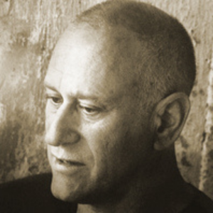 there is a black and white photo of a man with a bald head
