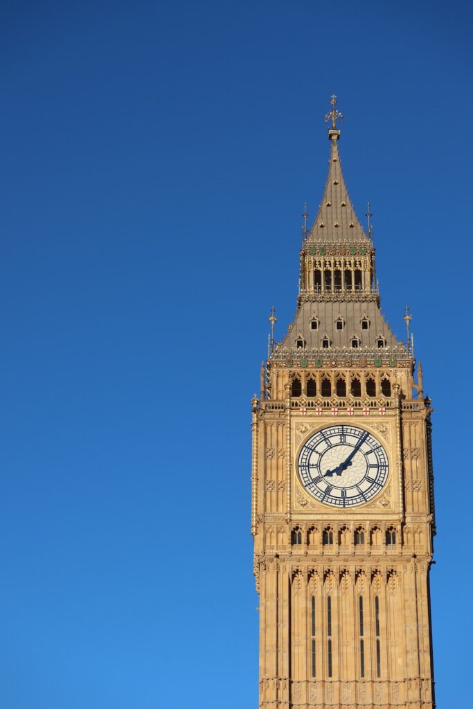 "Big Ben" tower against a clear blue sky."